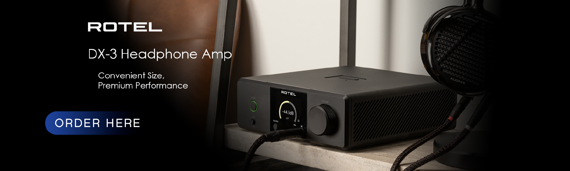 A Black Rotel DX-3 Headphone Amplifier on a shelf
